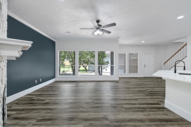 1826 Cheyenne River Cir, Sugar Land, TX 77478 - unfurnished living room featuring ceiling fan, stairs, a textured ceiling, baseboards, and crown molding