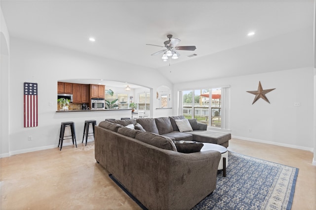 10711 Indian Trails Dr, Tomball, TX 77375 - living room with arched walkways, a ceiling fan, vaulted ceiling, baseboards, and recessed lighting