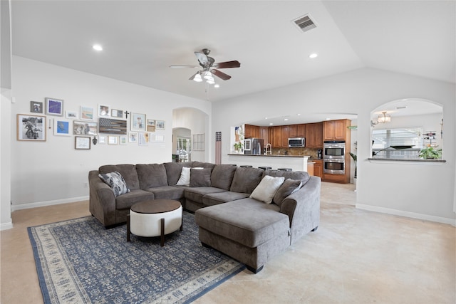 10711 Indian Trails Dr, Tomball, TX 77375 - living area featuring arched walkways, ceiling fan, recessed lighting, baseboards, and lofted ceiling