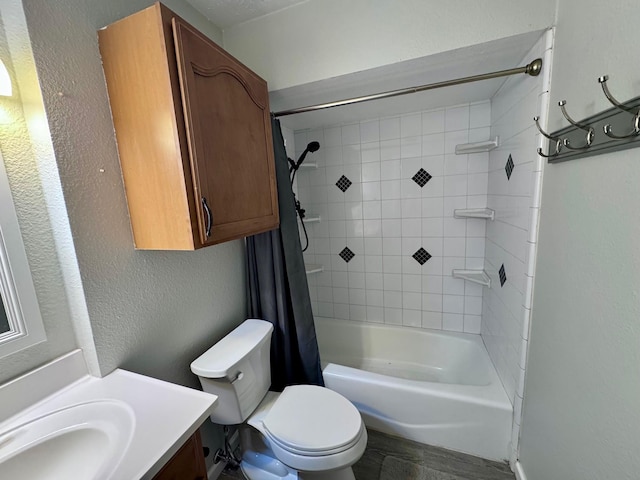 219 Lakeside Dr, Kemah, TX 77565 - bathroom with vanity, toilet, a textured wall, and shower / bathtub combination with curtain