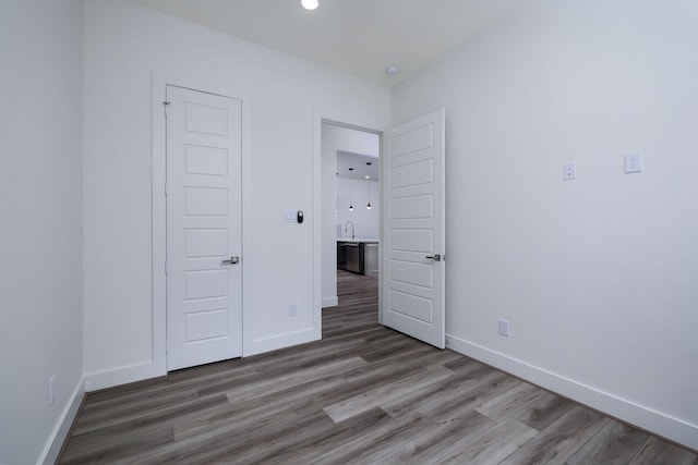 68 Fairway Dr, Trinity, TX 75862 - unfurnished bedroom featuring baseboards, wood finished floors, and recessed lighting