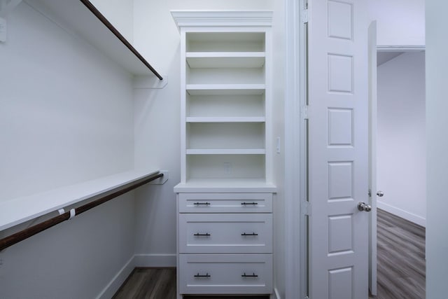 68 Fairway Dr, Trinity, TX 75862 - walk in closet with dark wood-style flooring