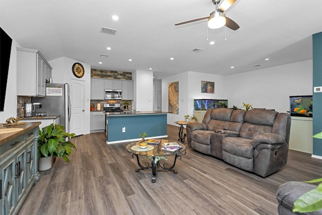315 Coral Drift Ct, Crosby, TX 77532 - living area with dark wood finished floors, a ceiling fan, and recessed lighting