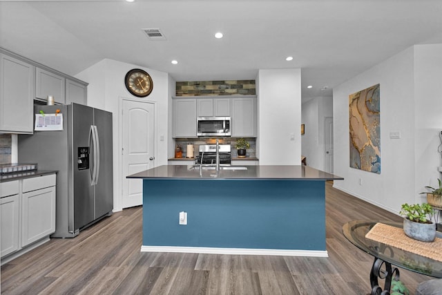 315 Coral Drift Ct, Crosby, TX 77532 - kitchen with appliances with stainless steel finishes, dark countertops, a sink, and recessed lighting