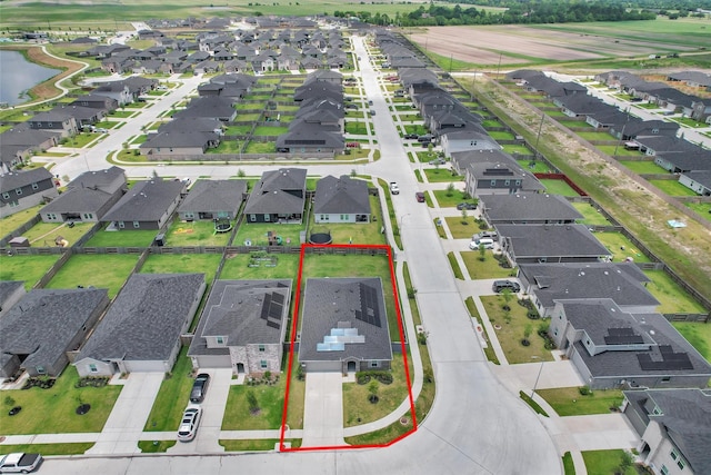 315 Coral Drift Ct, Crosby, TX 77532 - aerial perspective of suburban area with a nearby body of water and property boundaries highlighted