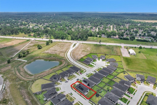 315 Coral Drift Ct, Crosby, TX 77532 - aerial view of residential area with property parcel outlined and a large body of water