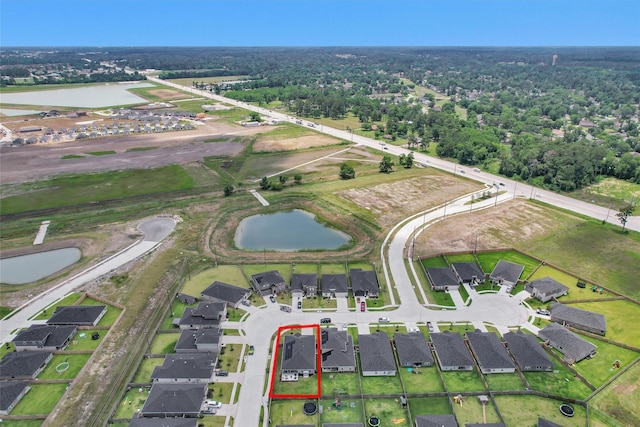 315 Coral Drift Ct, Crosby, TX 77532 - aerial overview of property's location featuring a large body of water, property parcel outlined, and nearby suburban area
