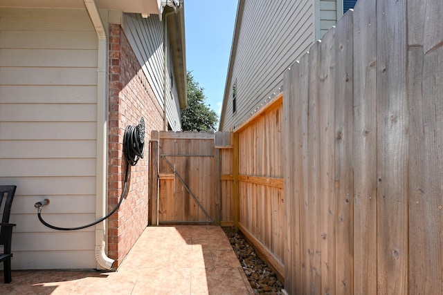 26414 Longview Creek Dr, Katy, TX 77494 - view of home's exterior with brick siding and a gate