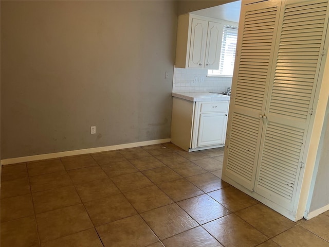 1611 W Gulf Bank Rd, Houston, TX 77088 - laundry room featuring tile patterned flooring and baseboards