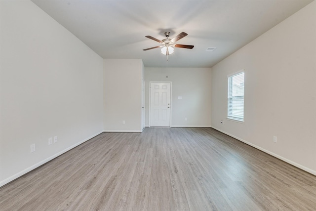 27398 Axis Deer Trl, Magnolia, TX 77354 - empty room featuring a ceiling fan, wood finished floors, and baseboards