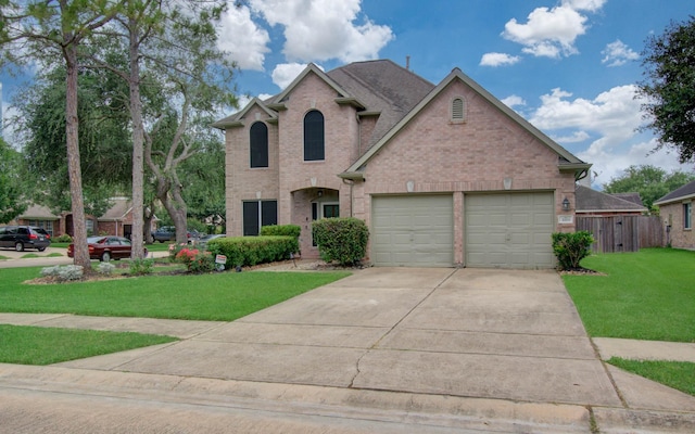 3203 Blaesser Dr, Pearland, TX 77584 - traditional home with brick siding, concrete driveway, an attached garage, and a front lawn