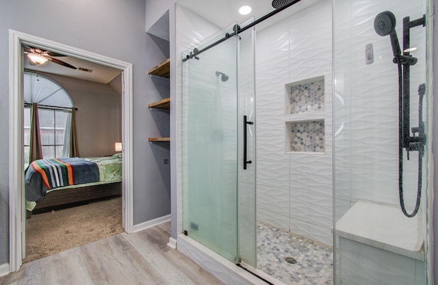 3203 Blaesser Dr, Pearland, TX 77584 - ensuite bathroom with wood finished floors, a shower stall, baseboards, and ceiling fan