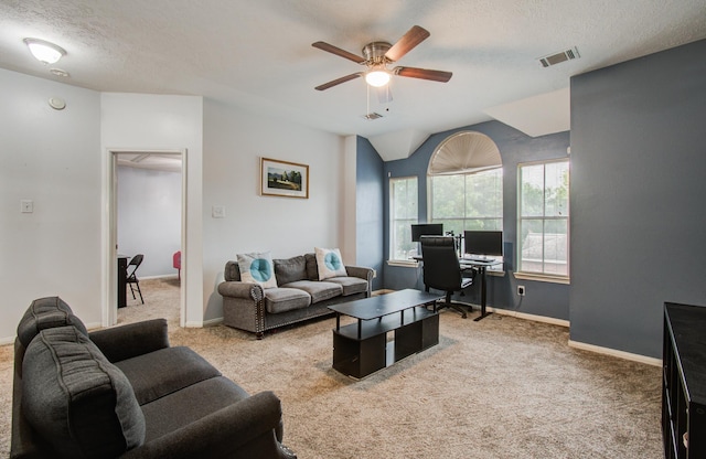 3203 Blaesser Dr, Pearland, TX 77584 - living room featuring a desk, carpet floors, a ceiling fan, a textured ceiling, and baseboards