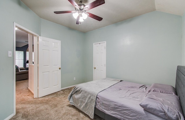 3203 Blaesser Dr, Pearland, TX 77584 - carpeted bedroom with vaulted ceiling, a ceiling fan, and baseboards