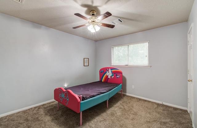 3203 Blaesser Dr, Pearland, TX 77584 - carpeted bedroom with baseboards, a ceiling fan, and a textured ceiling