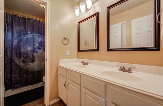 3203 Blaesser Dr, Pearland, TX 77584 - full bathroom with double vanity, tile patterned flooring, toilet, and a shower with shower curtain
