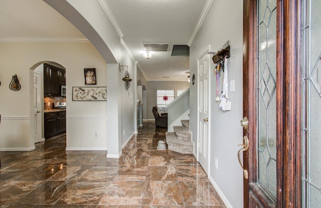 3203 Blaesser Dr, Pearland, TX 77584 - foyer entrance featuring dark marble finish flooring, baseboards, ornamental molding, stairs, and arched walkways