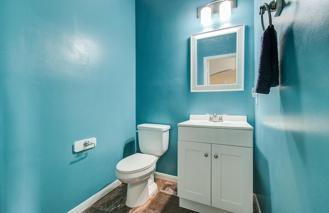 3203 Blaesser Dr, Pearland, TX 77584 - bathroom with toilet, baseboards, and vanity