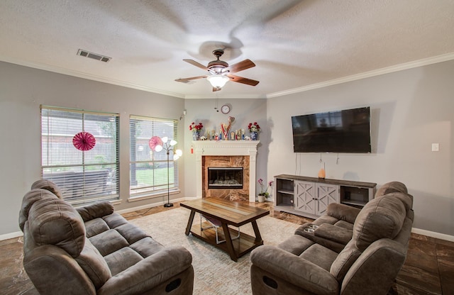 3203 Blaesser Dr, Pearland, TX 77584 - living area with baseboards, crown molding, ceiling fan, a textured ceiling, and a premium fireplace