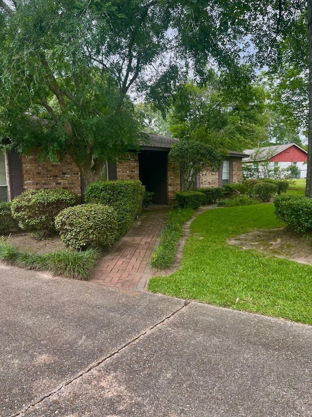 24360 Webb Rd, Porter, TX 77365 - view of front of house with brick siding and a front yard