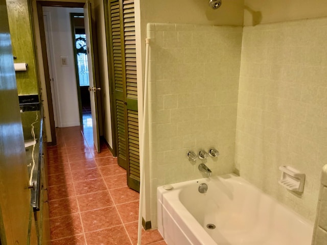 24360 Webb Rd, Porter, TX 77365 - bathroom featuring tile patterned floors and tub / shower combination