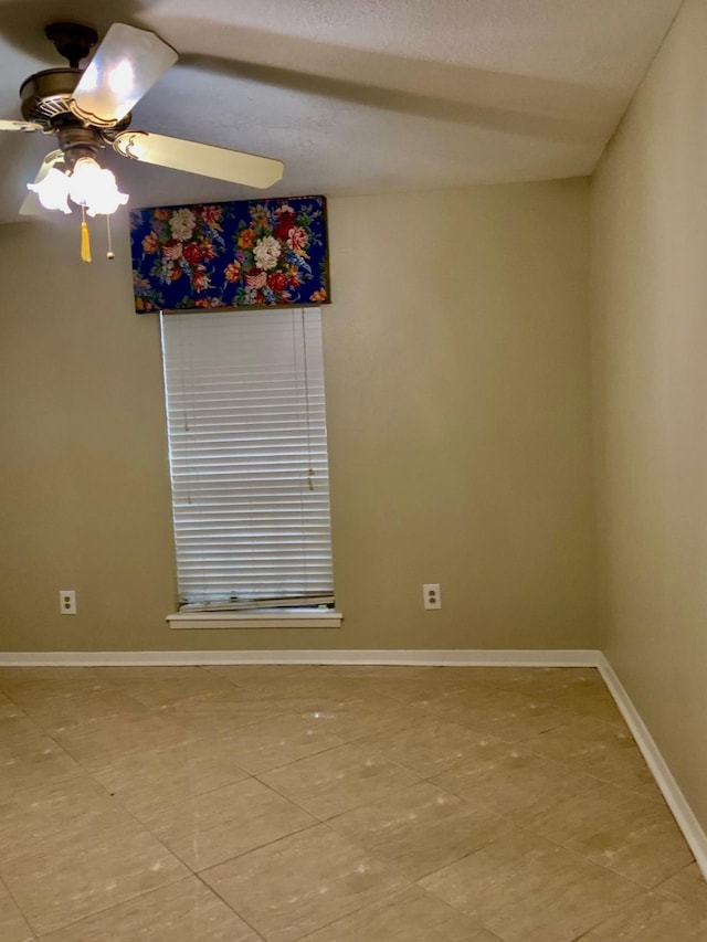 24360 Webb Rd, Porter, TX 77365 - spare room with baseboards, a ceiling fan, and light tile patterned floors