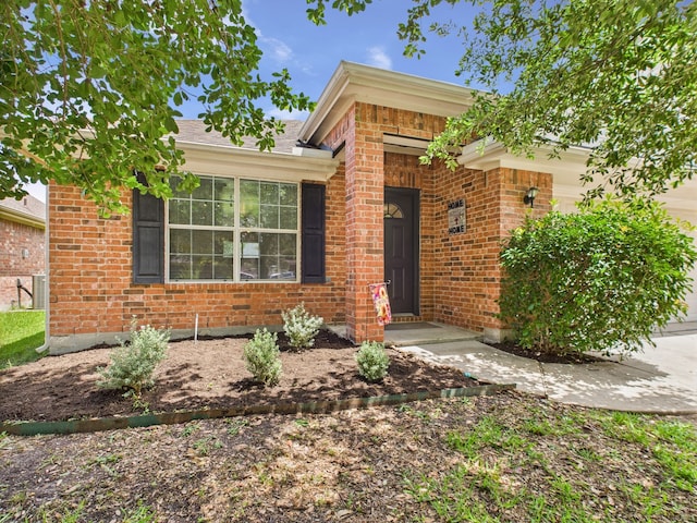 26940 Carriage Manor Ln, Kingwood, TX 77339 - ranch-style home featuring brick siding and an attached garage