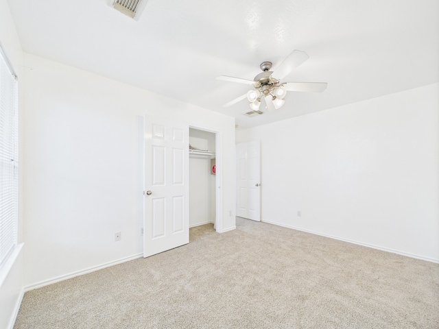 26940 Carriage Manor Ln, Kingwood, TX 77339 - unfurnished bedroom featuring light carpet, baseboards, a closet, and ceiling fan