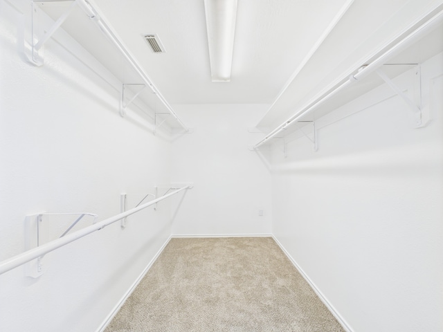 26940 Carriage Manor Ln, Kingwood, TX 77339 - spacious closet featuring carpet flooring
