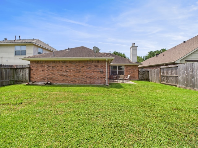 26940 Carriage Manor Ln, Kingwood, TX 77339 - view of yard with a patio