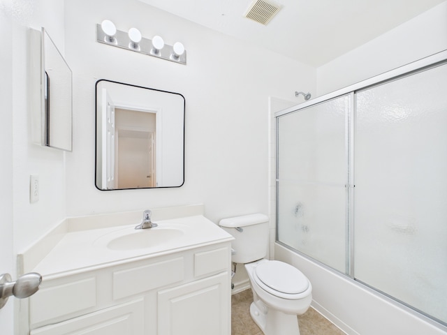 26940 Carriage Manor Ln, Kingwood, TX 77339 - bathroom with vanity, toilet, bath / shower combo with glass door, and tile patterned flooring