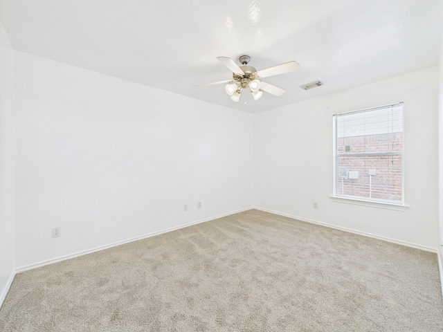 26940 Carriage Manor Ln, Kingwood, TX 77339 - carpeted spare room with ceiling fan and baseboards
