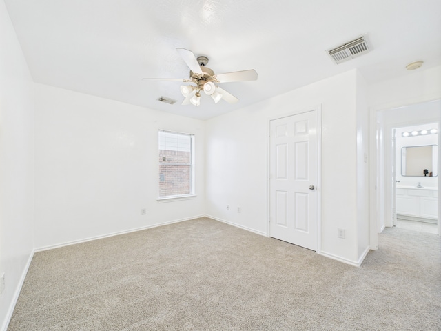 26940 Carriage Manor Ln, Kingwood, TX 77339 - unfurnished bedroom featuring carpet floors, baseboards, and ceiling fan
