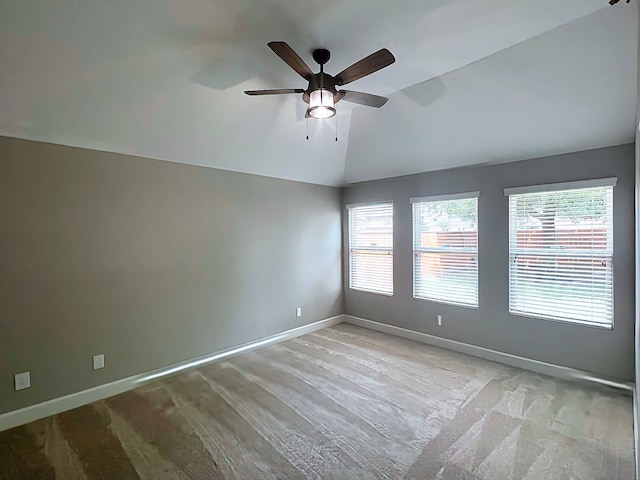 29375 Alba Rose Dr, Spring, TX 77386 - unfurnished room with lofted ceiling, a ceiling fan, baseboards, and light colored carpet