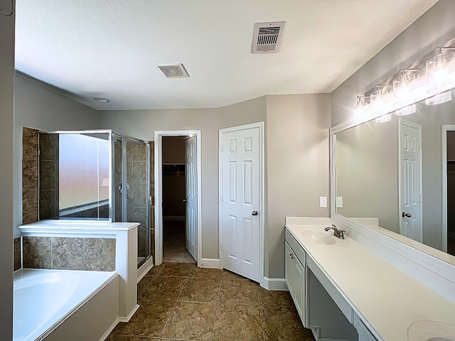 29375 Alba Rose Dr, Spring, TX 77386 - bathroom featuring double vanity, a stall shower, a garden tub, baseboards, and a walk in closet