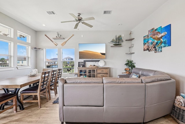 22212 Cantina Dr, Galveston, TX 77554 - living area with wood finished floors, ceiling fan, and recessed lighting