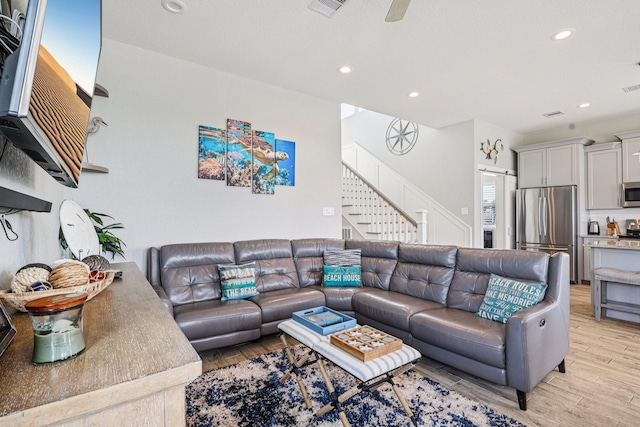 22212 Cantina Dr, Galveston, TX 77554 - living area with light wood-type flooring, stairway, recessed lighting, and a ceiling fan