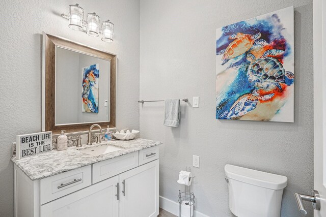 22212 Cantina Dr, Galveston, TX 77554 - half bath featuring toilet and vanity