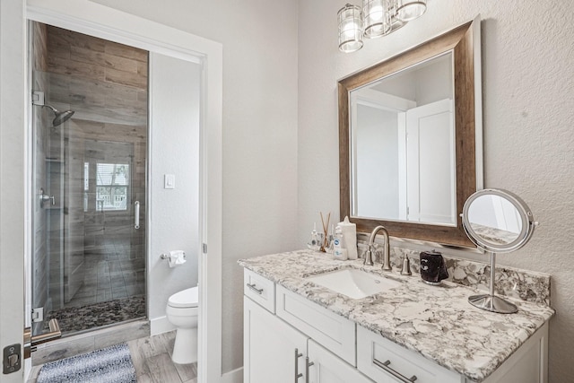 22212 Cantina Dr, Galveston, TX 77554 - full bathroom with vanity, a stall shower, and a textured wall