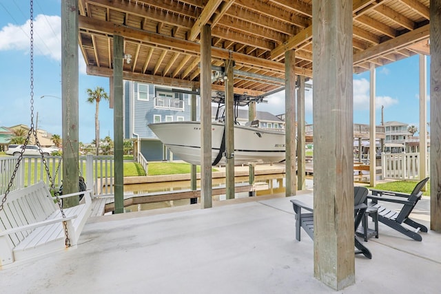 22212 Cantina Dr, Galveston, TX 77554 - view of patio featuring boat lift and a boat dock