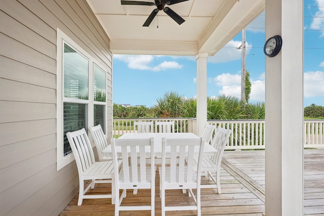 22212 Cantina Dr, Galveston, TX 77554 - wooden deck featuring ceiling fan and outdoor dining space