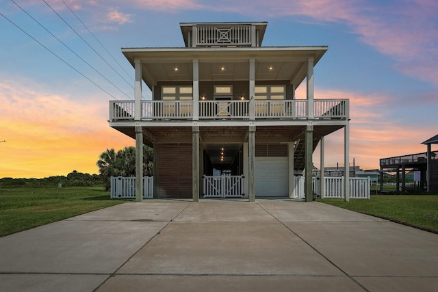 22212 Cantina Dr, Galveston, TX 77554 - raised beach house featuring a garage and driveway