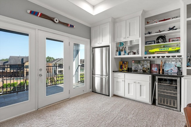 211 Valmar St, Kemah, TX 77565 - indoor wet bar with freestanding refrigerator, beverage cooler, and light colored carpet