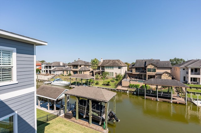 211 Valmar St, Kemah, TX 77565 - dock area featuring boat lift, a residential view, and a water view