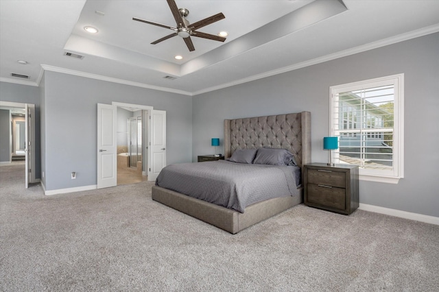 211 Valmar St, Kemah, TX 77565 - carpeted bedroom featuring baseboards, a raised ceiling, crown molding, recessed lighting, and ensuite bath