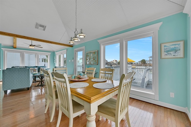 3906 Bridge Harbor Dr, Galveston, TX 77554 - dining area featuring lofted ceiling, light wood-style floors, a ceiling fan, baseboards, and a chandelier