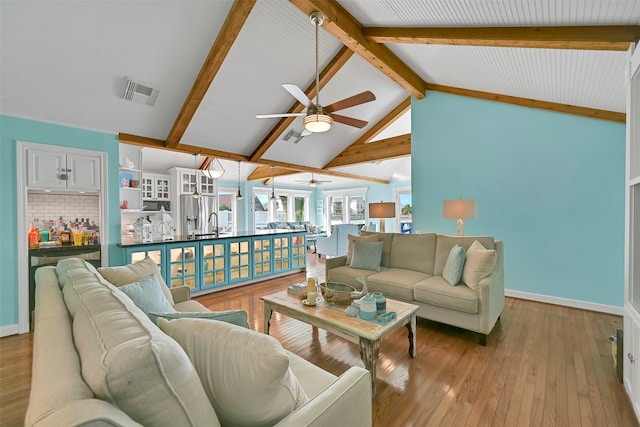 3906 Bridge Harbor Dr, Galveston, TX 77554 - living room featuring a ceiling fan, wood-type flooring, and baseboards