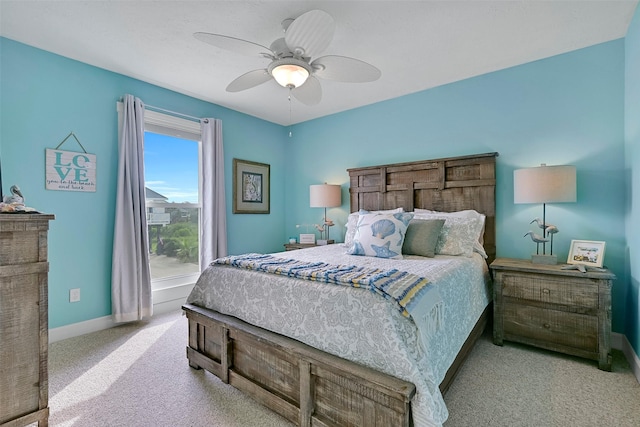 3906 Bridge Harbor Dr, Galveston, TX 77554 - carpeted bedroom with baseboards and a ceiling fan
