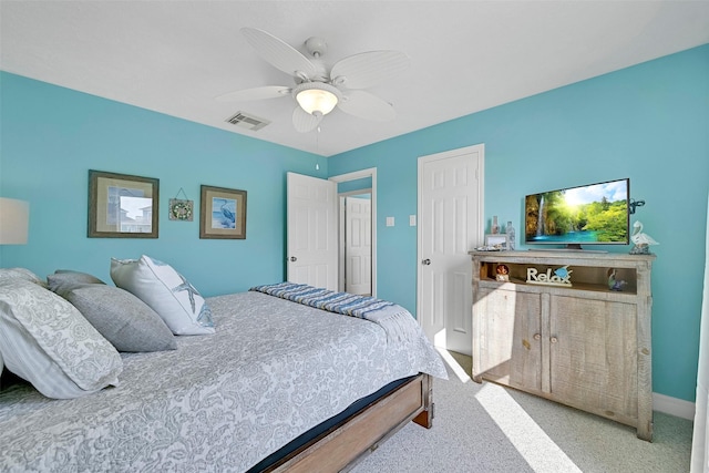 3906 Bridge Harbor Dr, Galveston, TX 77554 - bedroom featuring carpet floors, a ceiling fan, a closet, and baseboards