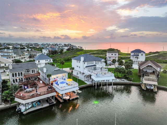 3906 Bridge Harbor Dr, Galveston, TX 77554 - aerial view at dusk of a water view and a residential view
